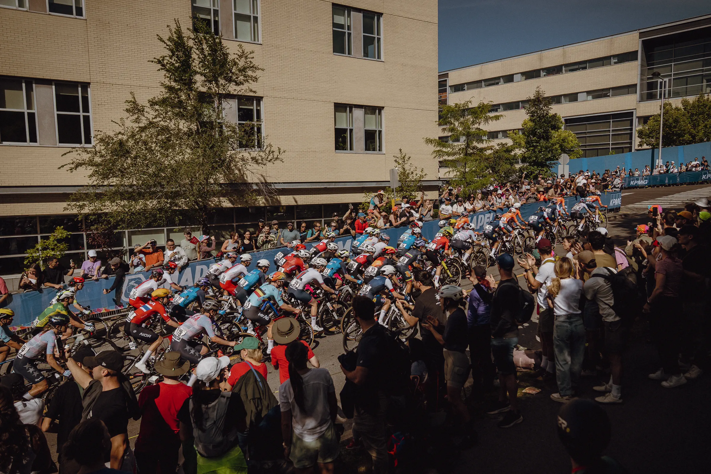 A dense World Championships crowd fills the Mount Royal course edge beneath Montréal architecture in 2026