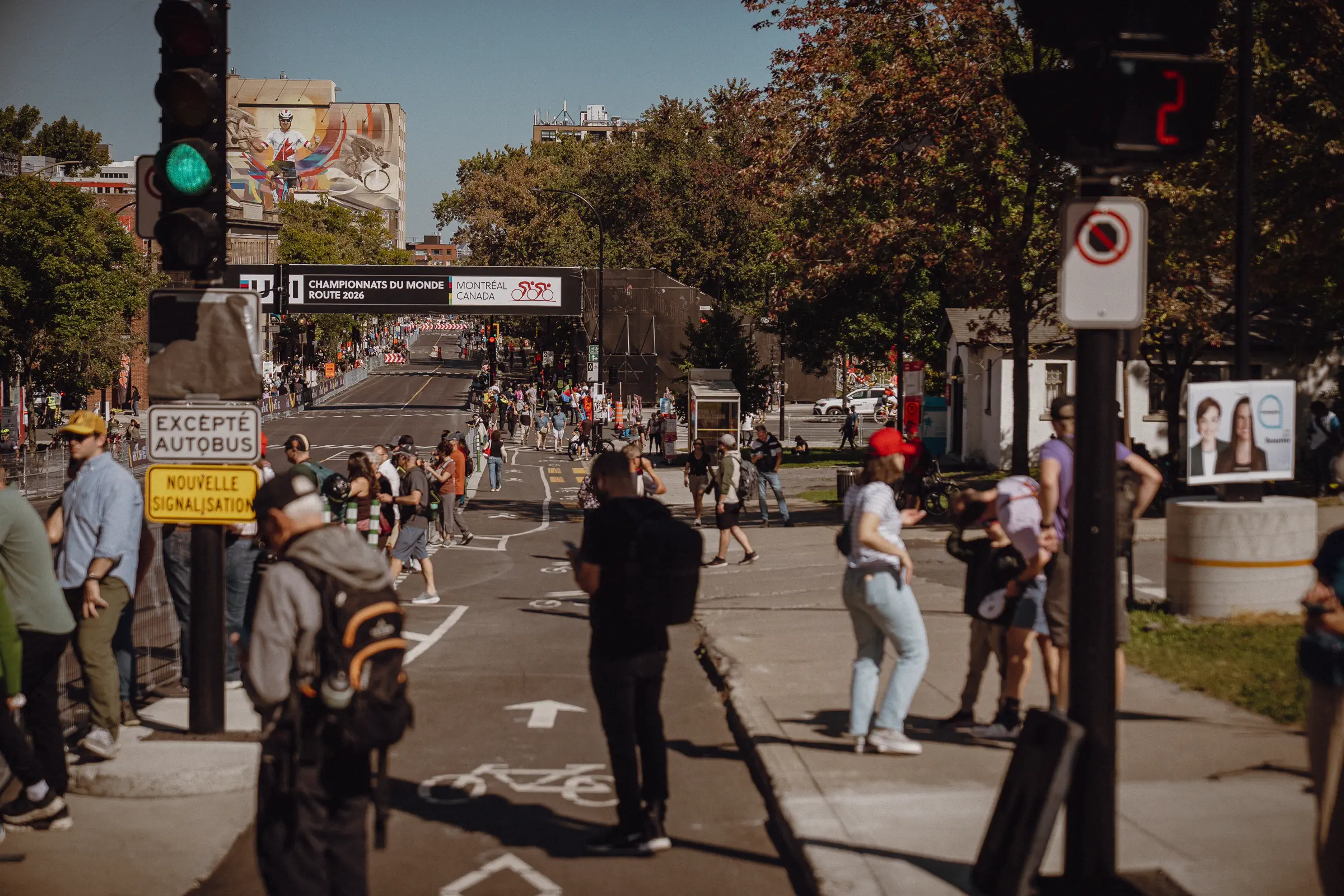 Spectators and course staff gather at a Montréal intersection as the World Championships take over the street
