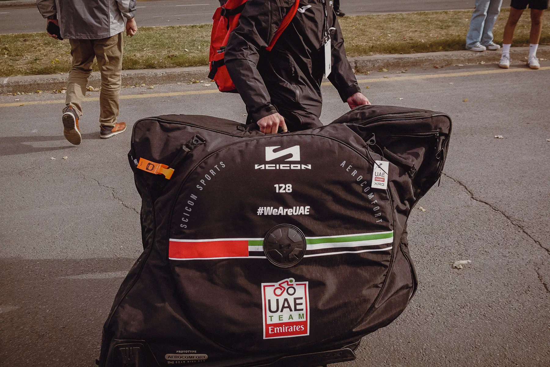 Team luggage and equipment bags wait on the pavement before being moved into position