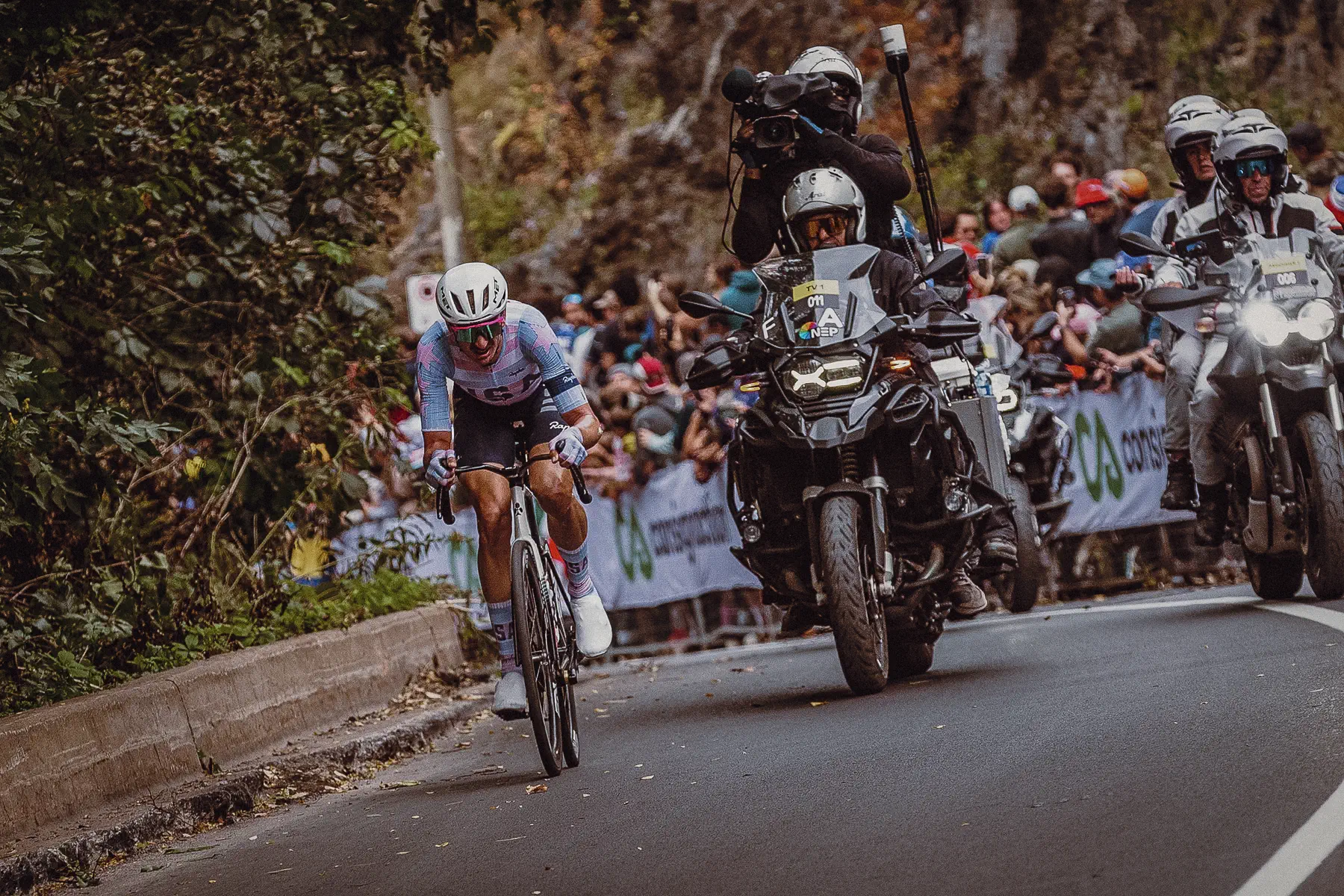 The Elite Men winner rides clear ahead of the race convoy during the decisive move